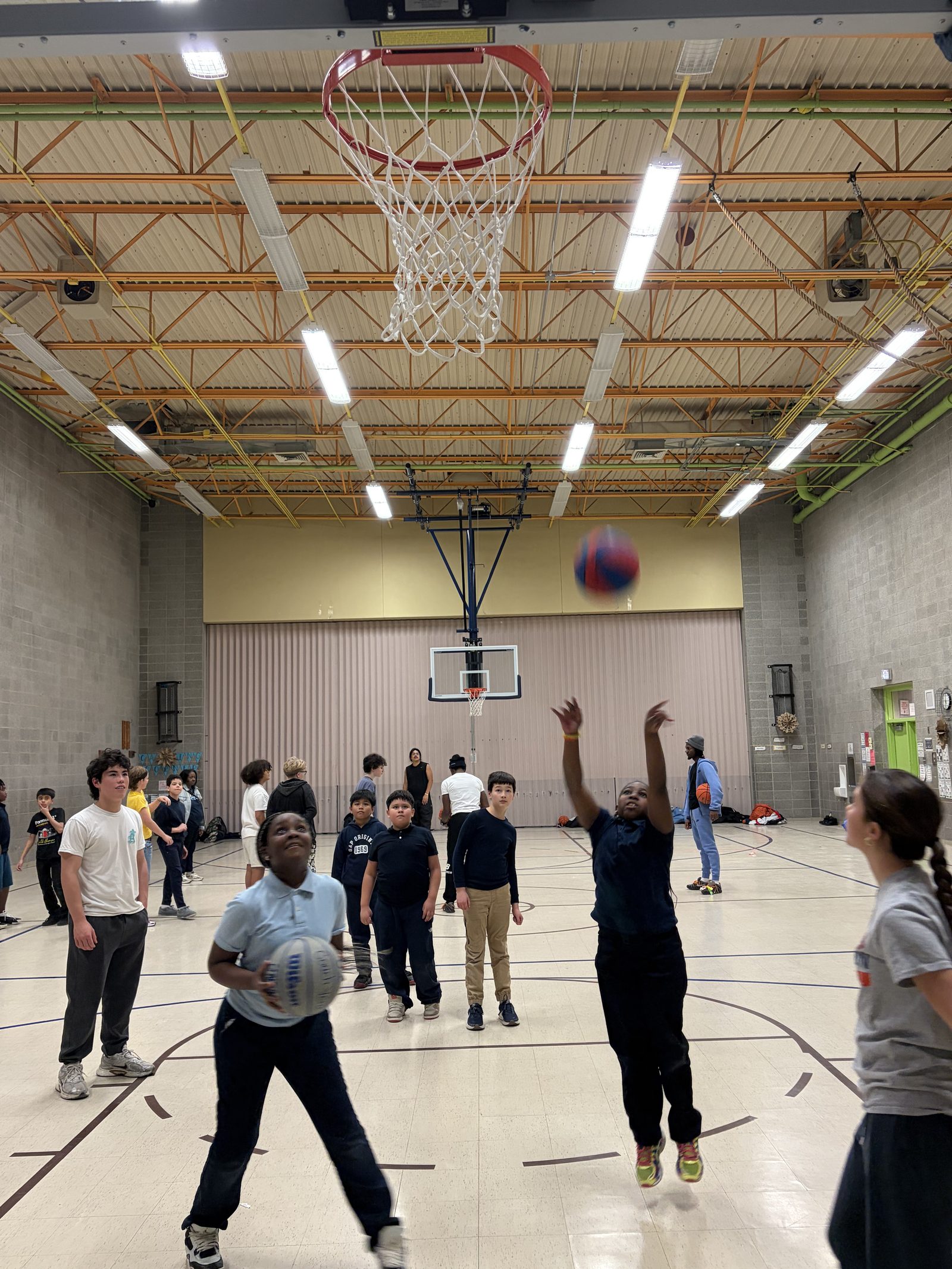 Basketball mid-flight toward the hoop