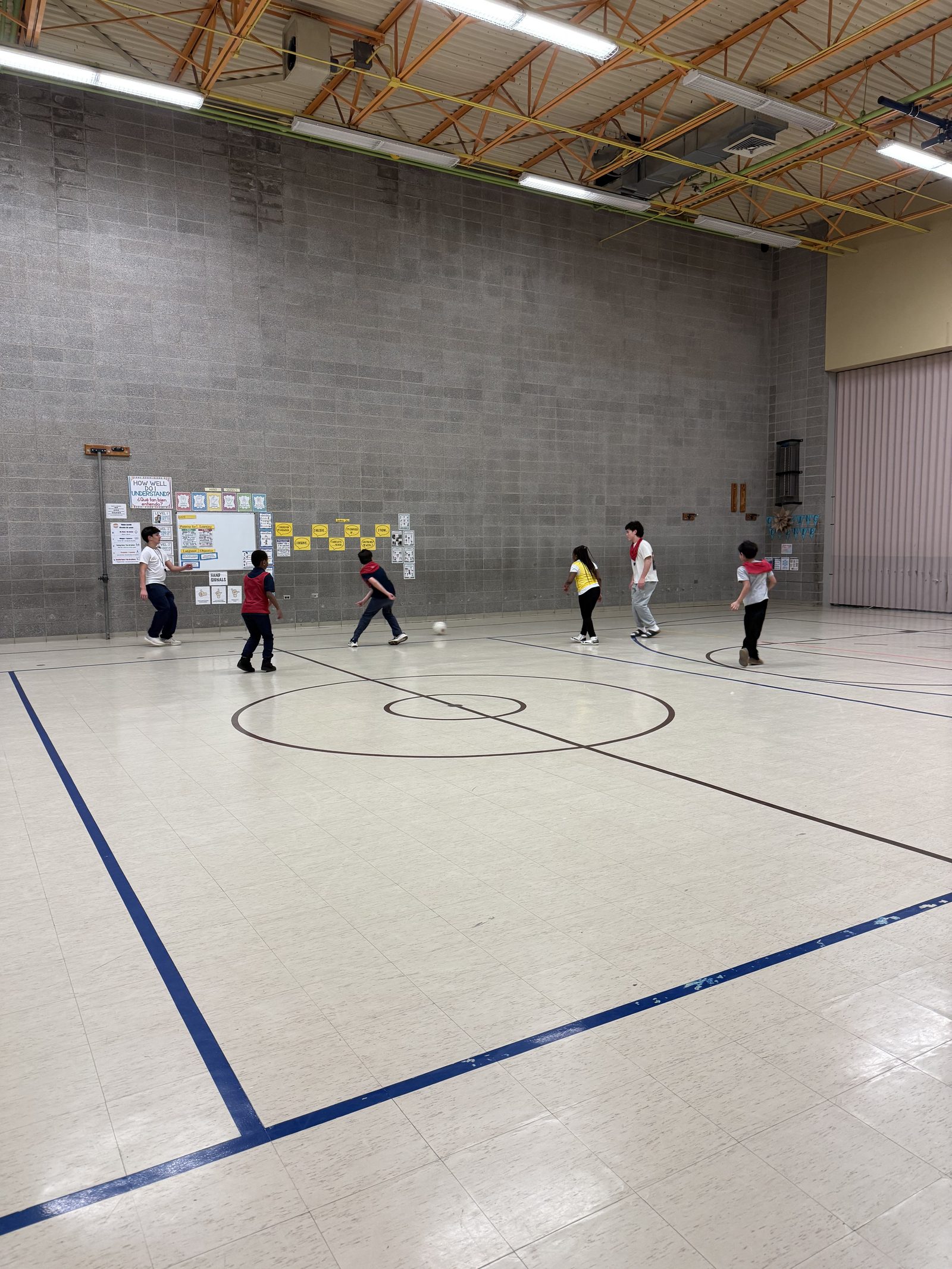 Soccer play inside the Horace Greeley gym
